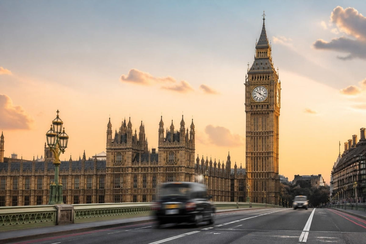 Big Ben and the Houses of Parliament beside Westminster Bridge over the River Thames at dusk, London, United Kingdom