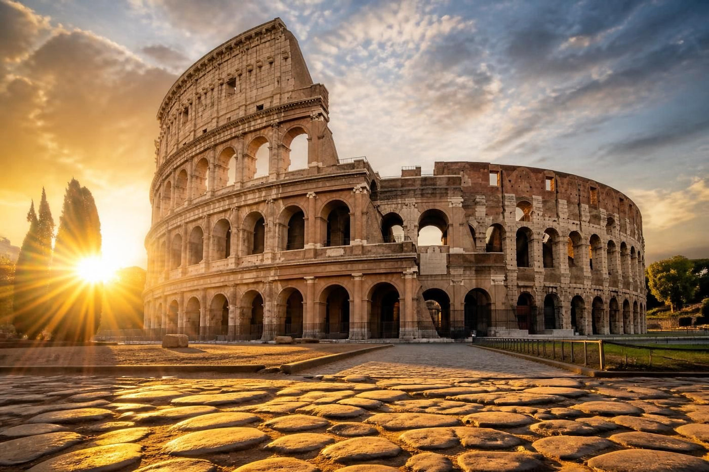 The Colosseum in Rome at golden hour, with travellers walking past on the cobbled street below
