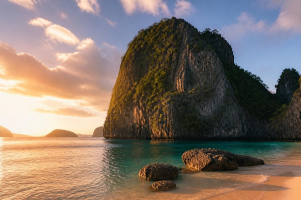 Traditional outrigger bangka boats moored in the turquoise water of a limestone lagoon in El Nido, Palawan, Philippines